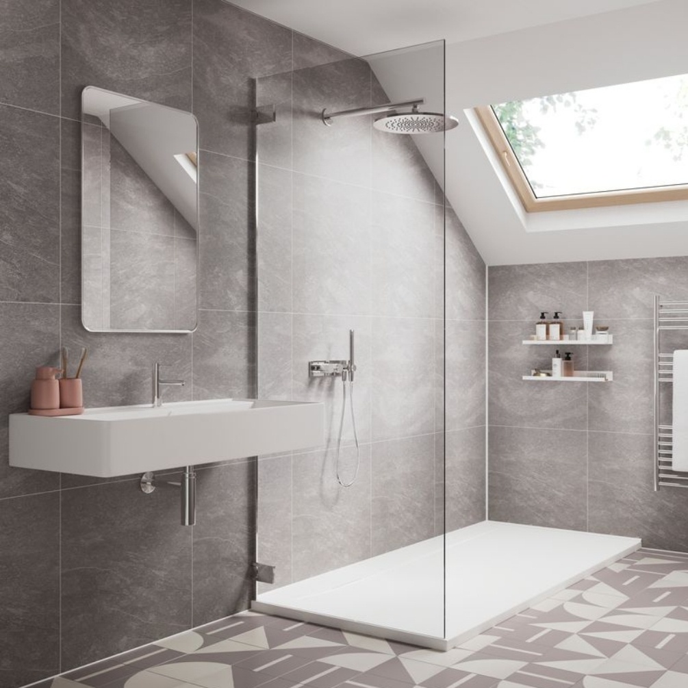 Lifestyle image of the Showerwall Laminate Natural Slate 2400mm x 600mm Square Tile Effect Wall Panel - SWT07 installed in a loft conversion bathroom with walk-in shower and wall-hung basin